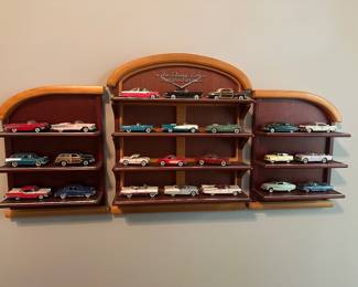 vintage Franklin Mint "Classic Cars of the Fifties" 1:43 scale precision die-cast model car collection mounted on its custom wooden wall display shelves. [1] (https://fineart.hallsgb.com/auction/lot/lot-131---franklin-mint-classic-cars-of-the-50s-and-display-unit