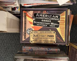 decorative metal builder plates from historic locomotive companies, including the American Locomotive Company and the Baldwin-Lima-Hamilton Corporation.