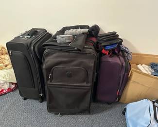 assorted luggage pieces