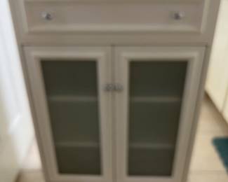 This is a tall piece of furniture. Almost big medicine cabinet.