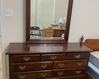 Dresser with its mirror. There is a matching chest of drawers.