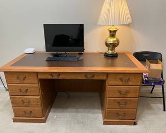 Large, nice desk. Also, the brass lamp is for sale.