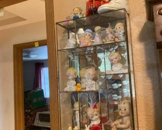 Mirrored Display Shelf With Baby Figurines