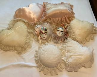 Two Masquerade Mask Wall Hangings with Heart Shaped and Decorative Pillows
