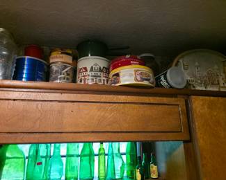 Tins and green glassware