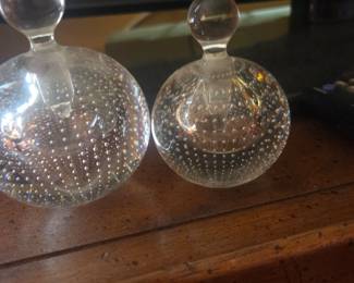 Perfume bottles.  Because women take the Chanel No 5 and put in in hers
