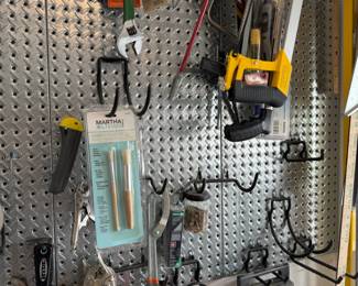 Diamond Plate Metal Pegboard with Assorted Hand Tools and Workshop Accessories