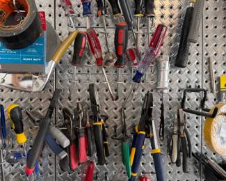 Assorted Hand Tool Collection on Pegboard