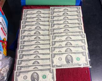 Collection of 25 consecutive serial number two dollar bill bills