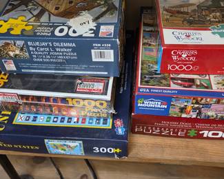 Assorted Vintage and Contemporary Jigsaw Puzzles including Charles Wysocki, White Mountain, EuroGraphics, and Great American Puzzle Factory