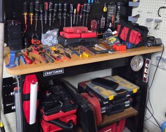 Craftsman 72-inch Workbench with Pegboard and Tool Assortment