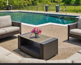 Another view of the EBEL all season wicker patio furniture:  Curved sectional couch, loveseat, armchairs (2) and "chat" table