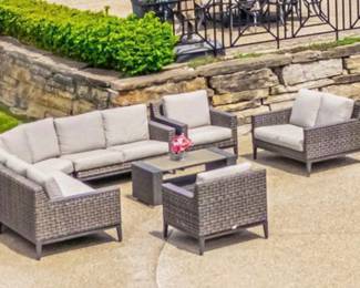 Another view of the EBEL all season wicker patio furniture:  Curved sectional couch, loveseat, armchairs (2) and "chat" table 