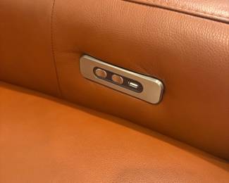 controls on inside of arm on both side of loveseat