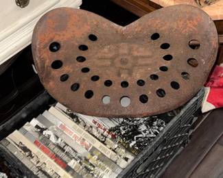 Military books & vintage metal tractor seat