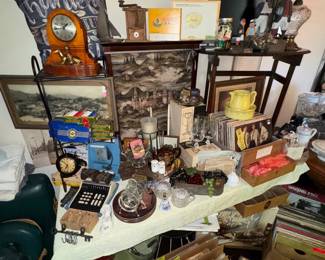 Fireplace screen, vintage tables, pictures, glassware, vintage records, lamp, vintage poker chips, cigar boxes