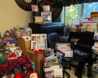 File cabinet, Christmas wreath, supplies & decorations, Santa & snowmen, office chair, Easter decorations, clocks, office chairs