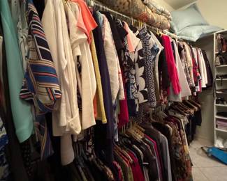 Hanging Clothing And Folded Bedding