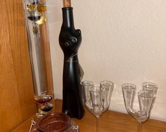Stemmed Glasses And Decorative Bottles