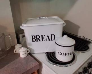 vintage-style white enameled metal bread box with bold black "BREAD" lettering