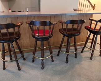 Four wooden bar stools