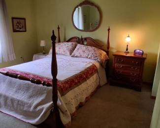 Four-Poster Bed: Features classic turned wooden posts