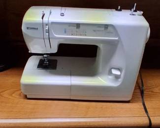 white Kenmore Model 385 mechanical sewing machine