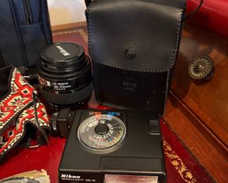 J58 - $120. Nikkon FG 35mm SLR Film Camera. Lens and Accessory Lot. Camera is untested.