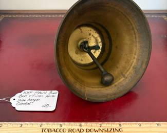 J15 - $20. Wall Mount Brass Bell with Horse-shoe Hanger. The bell has a crack.