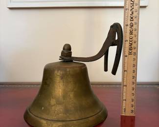 J15 - $20. Wall Mount Brass Bell with Horse-shoe Hanger. The bell has a crack.
