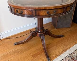 J161 - $95. Vintage Duncan Phyfe Style Drum Table with A Leather Top and Brass Paw Feet. Measures 32" Diameter x 27" Tall.
