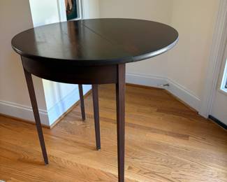 J96 - $85. Demi-Lune Flip Top Entry Table. Measures 32.25" W x 16" D x 30.5" Tall. Extended Top Measures 31.75" Diameter.