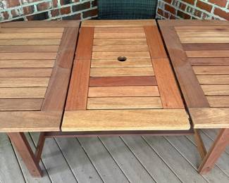 J36 - $400. Teak Patio Table. Measures 63" long x 35.5" wide + 19.5" butterfly leaf. Overall very good condition - has been used on a covered, screened in porch.