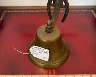 J15 - $20. Wall Mount Brass Bell with Horse-shoe Hanger. The bell has a crack.