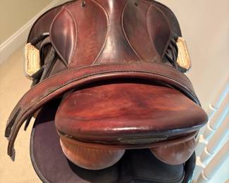J101 - $500. Stubben Roxane Saddle with Stand. 17.5" seat. 31 cm tree. Serial # 2949956. Made in Switzerland. Light cracking and some discoloration on the seat. Includes 54" leather girth, Lami-Cell gel saddle pad & Metal Rack.