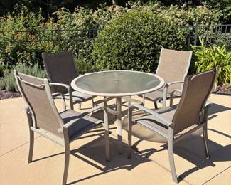 J64 - $275. 7 Sunbrella Patio Chairs. Measures 28.25" W x 21.5" D x floor to seat 17.5" x 39" Tall. Patio Table Measures 44" D x 28" Tall.