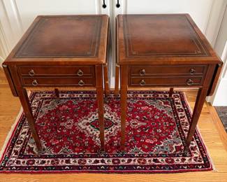 J159 - $150. Pair Of Vintage Drop-Leaf Side Tables with Leather Tops and Brass Wheels. Measures 43" W x 17" W x 27.25" Tall. Each Leaf measures 8.5" W.