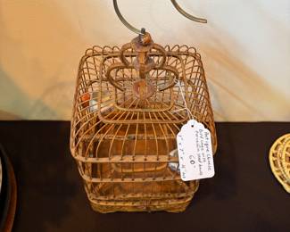 J111 - $60. Antique Chinese Bird Cage with Porcelain Seed and Water Bowls. Measures 7" W x 7" D x 16" Tall.