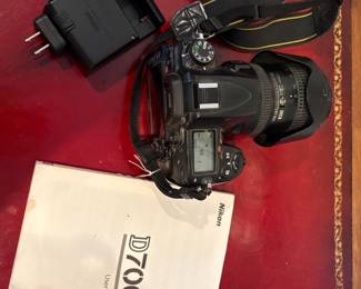 J56 - $180. Nikon D7000 Camera. Alikon DX SMW VR ED Aspherical 72 Lense. Powers on and looks to be in working order.