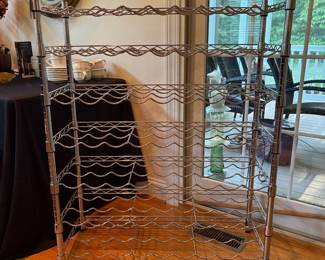 J114 - $35. Metal Wine Rack. Measures 35" w x 14" D x 44.5" Tall.