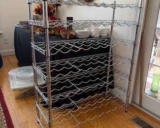 J114 - $35. Metal Wine Rack. Measures 35" w x 14" D x 44.5" Tall.