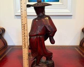 J28 - $30. Vintage Asian Fisherman Carved Red Wood. Cracked at the base.