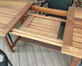 J36 - $400. Teak Patio Table. Measures 63" long x 35.5" wide + 19.5" butterfly leaf. Overall very good condition - has been used on a covered, screened in porch.