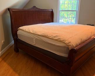 J132 - $350. King Sleigh Bed by Pulaski Furniture. Clean Mattress & Box Spring included if you want them! Measures 81" W x 88" L x 62" Tall.
