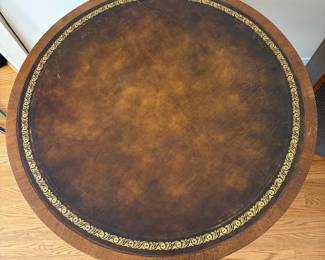J161 - $95. Vintage Duncan Phyfe Style Drum Table with A Leather Top and Brass Paw Feet. Measures 32" Diameter x 27" Tall.