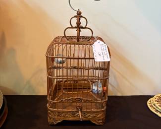 J111 - $60. Antique Chinese Bird Cage with Porcelain Seed and Water Bowls. Measures 7" W x 7" D x 16" Tall.