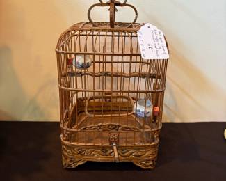 J111 - $60. Antique Chinese Bird Cage with Porcelain Seed and Water Bowls. Measures 7" W x 7" D x 16" Tall.