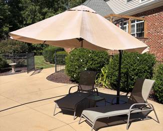 J69 - $100. Adjustable Patio Umbrella & Stand. Umbrella has some sun fading but otherwise in good condition.