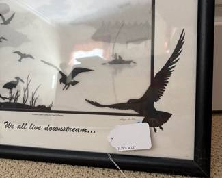 J53 - $20. "We All Live Downstream" framed poster. Measures 21.25"W x 31.25" Tall.