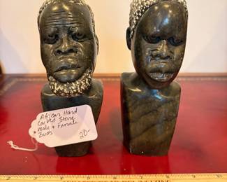 J33 - $20. African Hand Carved Stone Male and Female Busts. One has a chipped head.
